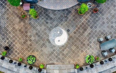 Aerial shot of outdoor space with Yin Yang symbol surrounded by potted plants in Banten, Indonesia.